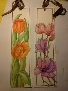 two bookmarks with flowers painted on them