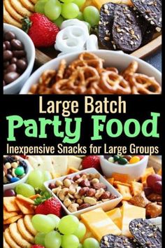 large batch party food with grapes, crackers and pretzels