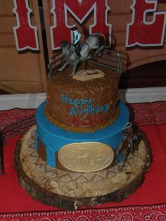 a birthday cake with a horse and rider on top