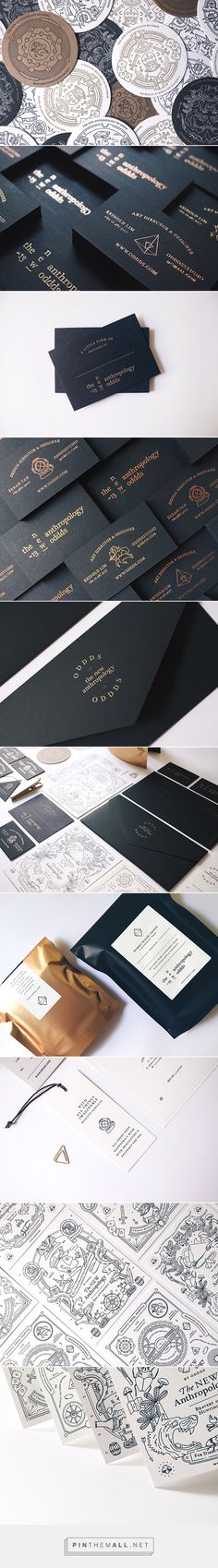 several different types of black and white papers with gold foil on them, all lined up in rows