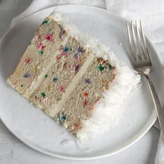 a piece of cake on a plate with a fork and napkin next to it, ready to be eaten