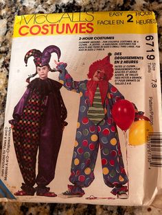 an image of two clowns on the cover of a sewing pattern for children's costumes