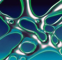 an abstract photograph of green and blue liquid swirling in the air on a dark background