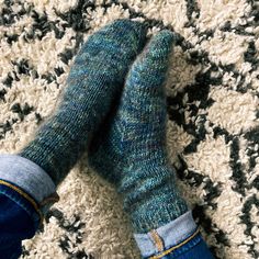 "A super cozy pair of worsted weight socks perfect to keeps those toes warm on cool mornings. MATERIALS 1 skein Red Sock Blue Sock Yarn, Comfort Sock DK (MC) 1 skein Red Sock Blue Sock Yarn, Wistful (CC2) GAUGE 24 sts and 36 rounds = 4\" in St st, after blocking NEEDLES US 5 (3.75 mm) double pointed needles OR 9 inch circulars OR equivalent needles for magic loop FINISHED MEASUREMENTS  Adult Small (Medium, Large) 6.75 (7.25, 8) inches circumference TOOLS Removable stitch markers, tapestry needle SKILL LEVEL Easy ✔ DISCLAIMER: All knitting patterns and crochet patterns are instant-download digital files. No patterns are shipped. Resell finished product with pattern credit. © Ashley Ratnam; All rights reserved" Comfortable Thick Knitted Socks, Cozy Hand Knitted Socks, Casual Green Knitted Socks, Hand Knitted Comfortable Yarn Socks, Cozy Knitted Yarn Socks, Cozy Hand-knitted Yarn Socks, Cozy Hand Knitted Yarn Socks, Comfortable Knitted Socks, Comfortable Blue Knitted Socks