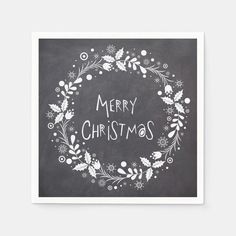 a christmas card with the words merry christmas written in white chalk on a blackboard