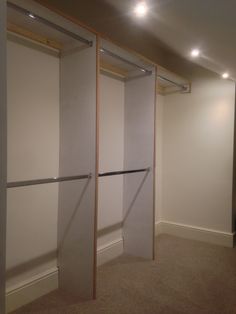 an empty room with some closet doors open