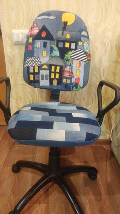 an office chair with a blue and white patterned seat cover on it's back