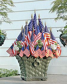 an arrangement of american flags in a basket