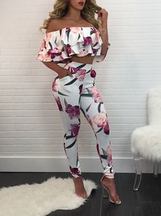 This sassy but sweet two piece set is sexy with a lovely floral pattern. Featuring a ruffled off-the-shoulder top and skinny fitted pants with an elastic waist. Pairs perfectly with wedges, heels or booties and is made with a blend of polyester, cotton and spandex for a fabulous fit. Comes in two fabulous floral color patterns. Two Piece Outfits Classy, Stylish Jumpsuit Fashion, Jumpsuits For Women Casual Summer, Jumpsuits For Women Casual, Long Pant Jumpsuit, Two Piece Outfits, Stylish Jumpsuit, Afrikaanse Mode, Casual Rompers