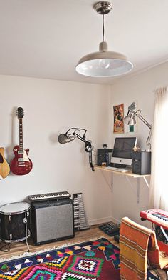 a room with guitars and other musical equipment