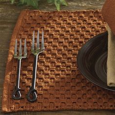 a place setting with utensils and a napkin