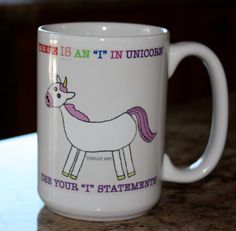 a white coffee mug with a unicorn on it