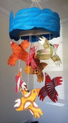 colorful paper fish mobile hanging from ceiling