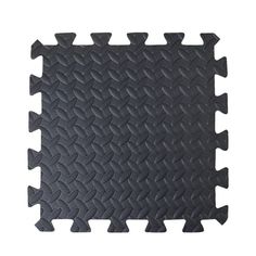 black rubber flooring tiles with different patterns on the bottom, and one in the middle