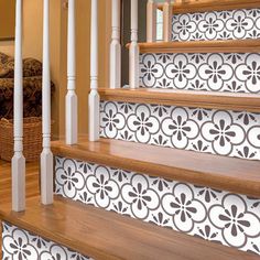 the stairs are decorated with black and white tiles