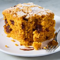 a close up of a piece of cake on a plate with a fork in it