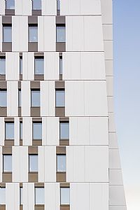 a tall white building with lots of windows