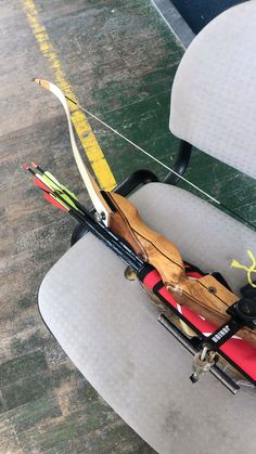 a bow and arrow sitting on top of a chair