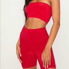 Two Piece Red Bandeau And Biker Shorts Red Tube Top For Spring Night Out, Red Tube Top For Summer Night Out, Red Stretch Tube Top For Summer, Summer Party Biker Shorts, Fitted Biker Shorts For Summer Parties, Red Stretch Tube Top For Spring, Trendy Red Shorts For Night Out, Red Biker Shorts For Summer, Trendy Red Bandeau Tube Top