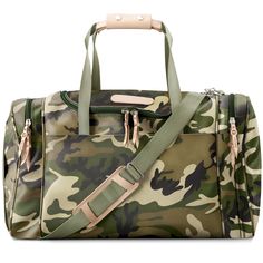 Jon Hart's most popular duffel is perfect in both form and function. With two compartments in each side and a U-shaped zipper up top, you can stay organized and find what you need when you need it. The trolley sleeve on back makes traveling a breeze. Just slip it over the extended handle of a rolling suitcase and this carry-on compliant bag is ready to roll. Natural leather trim. Fully zippered closures with silver hardware. Webbing handles with natural leather detail and silver snap closures. D Diaper Changing Pad, Burp Cloth Set, Bootie Sandals, Travel Kits, Short Sleeve Bodysuit, Stay Organized, Natural Leather, Travel Accessories, Leather Trims