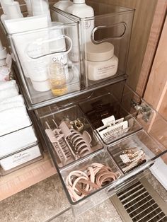 an organized drawer in a bathroom filled with personal care items