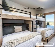 two bunk beds in a bedroom next to a window with the words built in bunkbeds on it