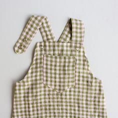 a green and white checkered overall with suspenders