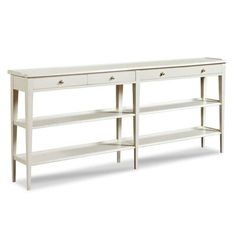 a white console table with two drawers on one side and an open shelf on the other