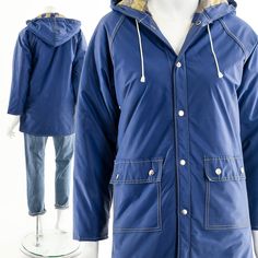 "- 70s/80s waterproof blue raincoat - lined with soft plaid - snaps on front - pockets on front Label: N/A Tag Size: N/A Fits like: M - L Material: Polyester, Nylon Condition: Excellent Clipped on Mannequin: No ✂ SIZE + FIT ✂ Length: 30\" / 76 cm Shoulders, seam to seam: Sleeve Length: 18\" / 46 cm Bust: 40\" / 102 cm Waist: 39\" / 99 cm Hips: 38\" / 97 cm All measurements are taken with garment lying flat. ALWAYS refer to measurements as vintage sizes run can vary greatly from today's modern si Blue Fleece-lined Windbreaker For Fall, Fall Raincoat With Fleece Lining For Rainy Weather, Weatherproof Long Sleeve Blue Outerwear, Blue Long Sleeve Weatherproof Parka, Blue Weatherproof Long Sleeve Parka, Blue Long Sleeve Weatherproof Outerwear, Navy Hooded Raincoat For Winter, Navy Hooded Winter Raincoat, Navy Long Sleeve Winter Raincoat