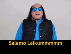 a man wearing sunglasses and a blue shirt with the words salamo laikum mmmm