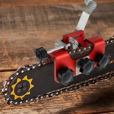 chainsaw chain sharpening jig on wooden table with text overlay that says chainsaw chain sharpening jig