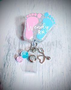 This listing is for a acrylic baby feet badge reel with image as shown. Handmade with acrylic, glitter, vinyl, and epoxy. Charms added with coordinating colors and may vary. *Please make note of processing times. Customized items may take up to 3 to 4 weeks. I try to get them out as soon as possible, but due to the volume of orders it may take the full 4 weeks. * Marking your order as a gift or upgrading shipping does not affect processing time. *If you absolutely need this item sooner than the Customizable Pink Craft Supplies, Pink Customizable Craft Supplies, Customizable Pink Craft Supplies For Crafting, Customizable White Craft Supplies For Hobby, Customizable Blue Craft Supplies For Personal Use, Ob Nurse, Stethoscope Charms, Ob Nursing, Labor And Delivery