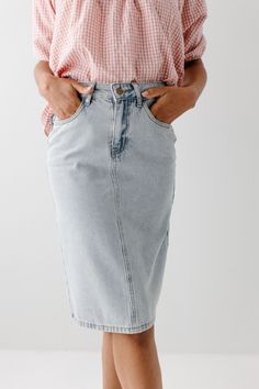 The 'Kyra' is another one of our very own exclusive denim skirts. Designed with everyday wear in mind, this skirt will pair well with just about any casual top in your wardrobe! This denim skirt is 100% cotton and does not have stretch, giving it a vintage vibe we love! Every woman needs a classic, straight denim skirt in her closet and this skirt is an excellent choice! Available in light or vintage wash. 100% Cotton Machine Wash Cold Gentle Cycle Do Not Bleach Hang to Dry Do Not Dry Clean Mode Dark Wash High Waist Cotton Skirt, Trendy Mid-rise Cotton Skirt, Trendy Dark Wash Cotton Skirt, High Waist Medium Wash Cotton Denim Skirt, High Waist Denim Blue Cotton Skirt, High Waist Medium Wash Denim Skirt, High Rise Dark Wash Cotton Skirt, Spring Cotton Mini Denim Skirt, Mid-rise Lined Denim Skirt