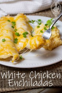 white chicken enchiladas on a plate with a fork