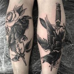 two black and white tattoos on both legs with birds, flowers and a knife in the middle