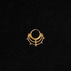 an image of a gold ring on a black background