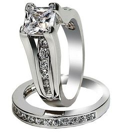 two wedding rings with princess cut diamonds on them