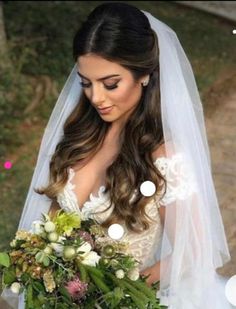 a woman in a wedding dress holding a bouquet