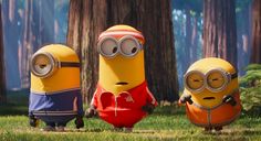 three minions from the movie despicables are standing in front of some trees