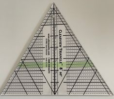 a triangle ruler is shown on the wall