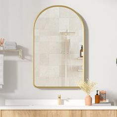 a bathroom with a sink, mirror and shelves on the wall next to each other