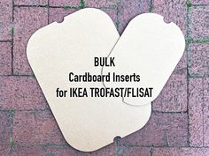 two white tags with words on them that read bulk cardboard inserts for ikea trafast / flask