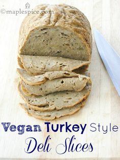 vegan turkey style deli slices on a cutting board with a knife