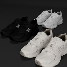 four pairs of new balance shoes on a black background