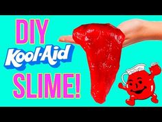 a hand holding a piece of red slime with the words diy kool aid on it