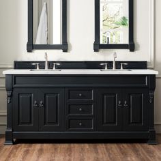 a double sink vanity with two mirrors above it in a white and black color scheme