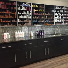 an empty pharmacy room with lots of bottles on the counter