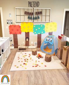 there is a play room with toys and decorations on the floor in front of it