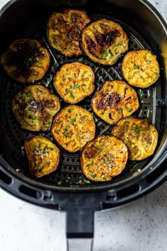 cooked eggplant in an air fryer with parmesan cheese and herbs