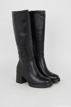 Knee-high silhouette crafted from supple faux leather Chunky platform sole for a subtle height boost Mid-height block heel measuring between 5 and 6.5cm Sleek pull-on style with stretch panel at the back Durable synthetic outsole for enhanced traction Exude a confident and stylish vibe with these versatile knee-high boots from Oasis. The faux leather construction lends a polished look, while the platform sole and mid-height block heel provide a comfortable stride. Pair them with a floral midi dress for a feminine touch at casual events or family gatherings, or team them with skinny jeans and a cosy knit for an effortlessly chic daytime ensemble. Cute High Heels Boots, Black Knee High Boots Low Heel, Cute Boots For Fall, Low Heel Knee High Boots, Knee High Boots No Heel, Boots Fall 2024, Black Heeled Boots Outfit, Knee High Boots Aesthetic, Knee High Boots Outfit Winter